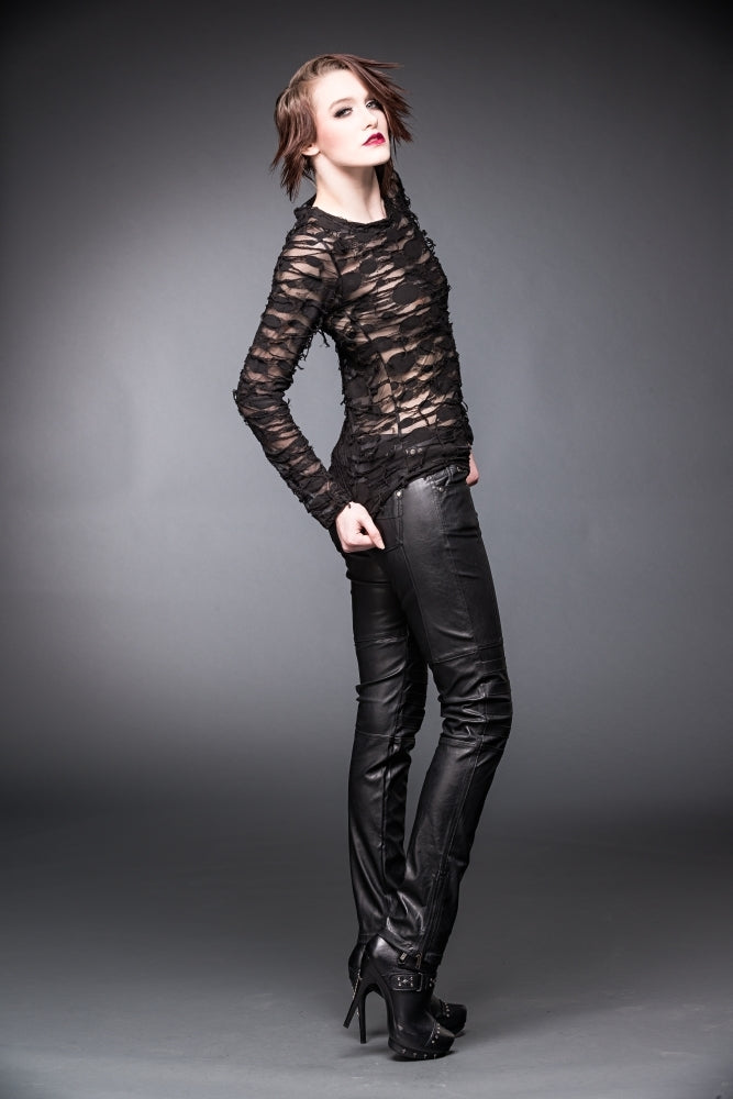 woman in Alice apocalyptic top with see through layers and black jeans Ministry of Style gothic collection